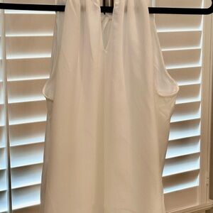 Elegant White Sleeveless Top with tie in the back.